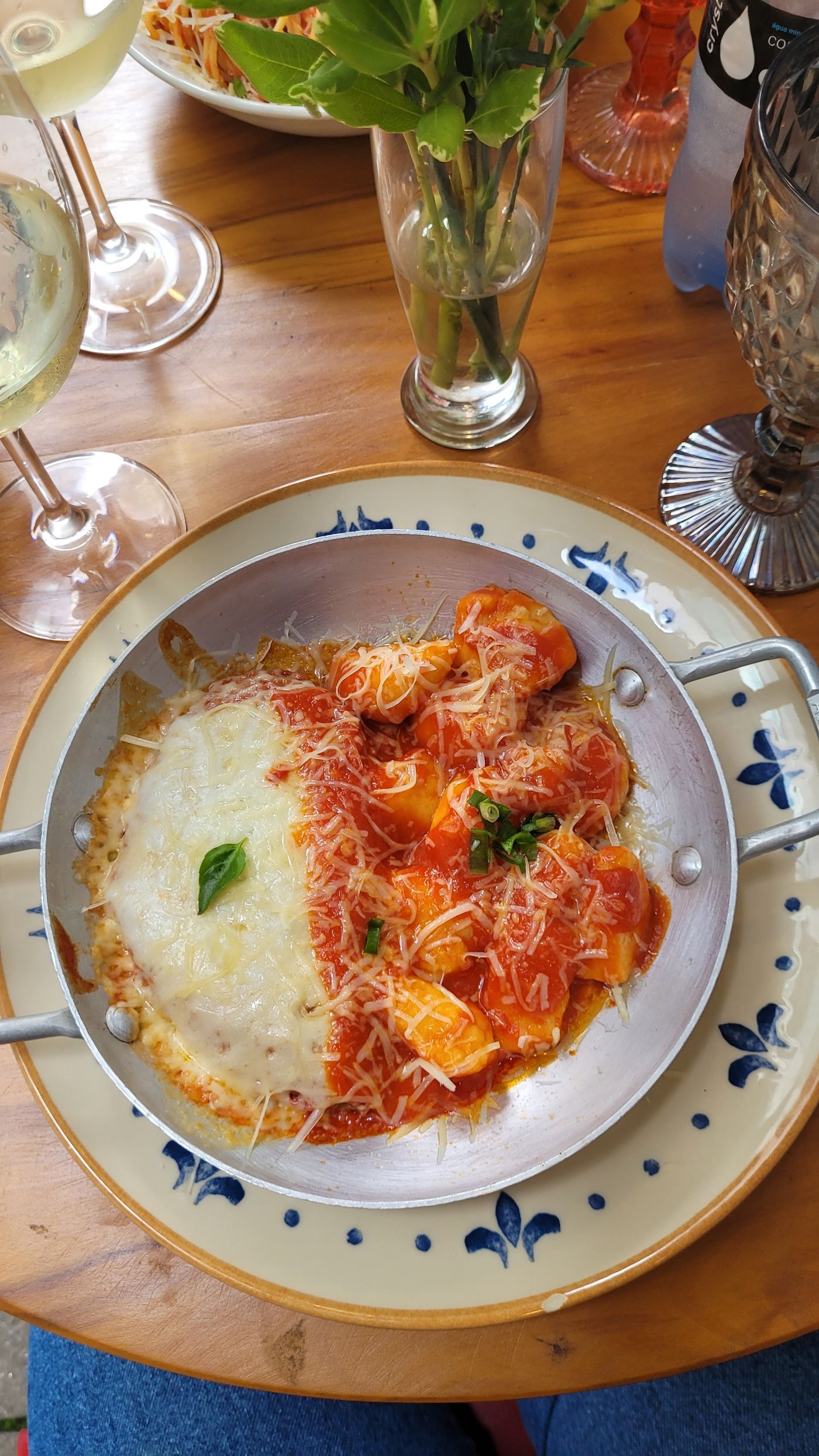 Baked tomato & mozzarella gnocchi; gnocchi, red tomato sauce, melted white cheese, green basil leaf