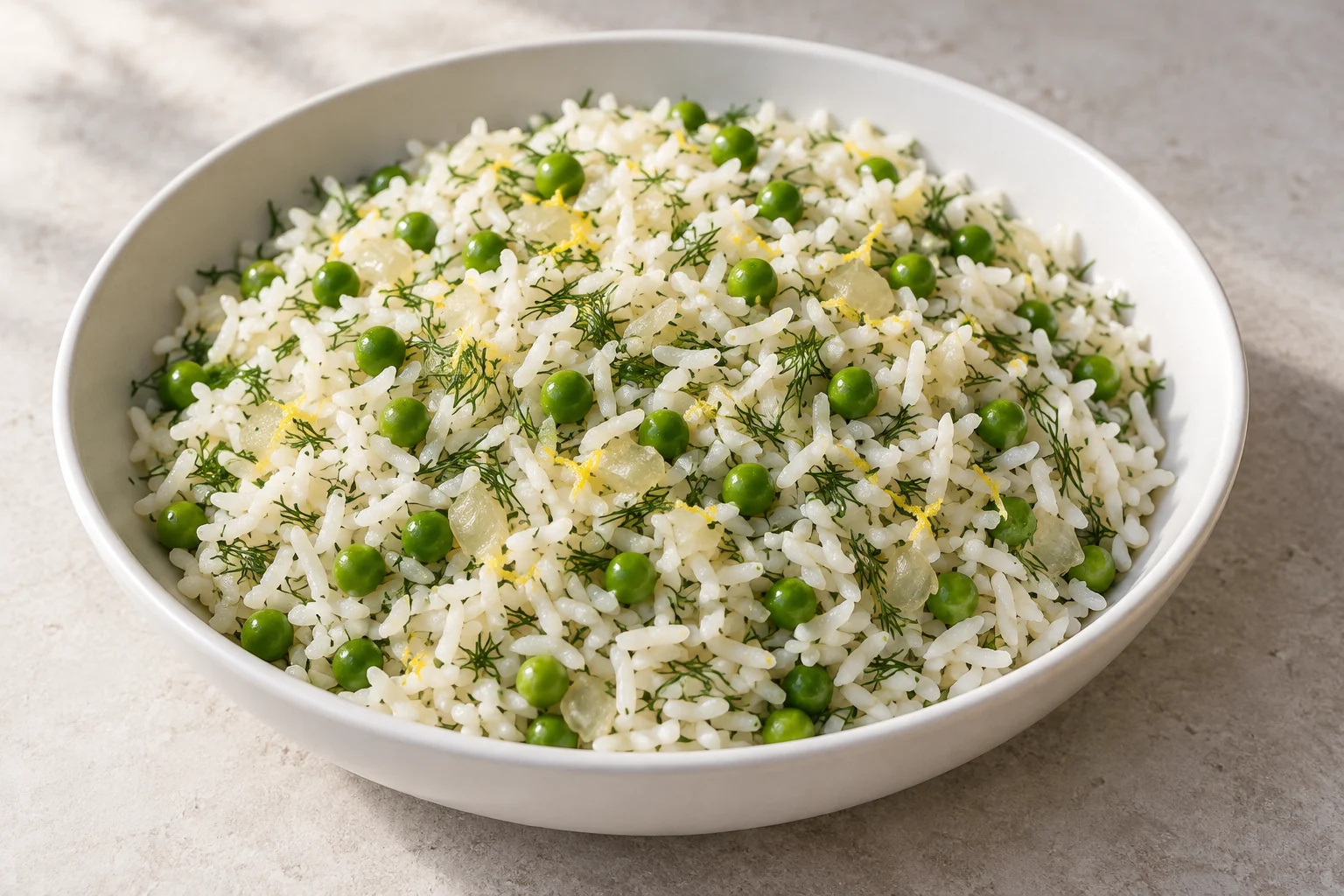 Fluffy long-grain rice with green peas, fresh dill and a bright lemon finish.