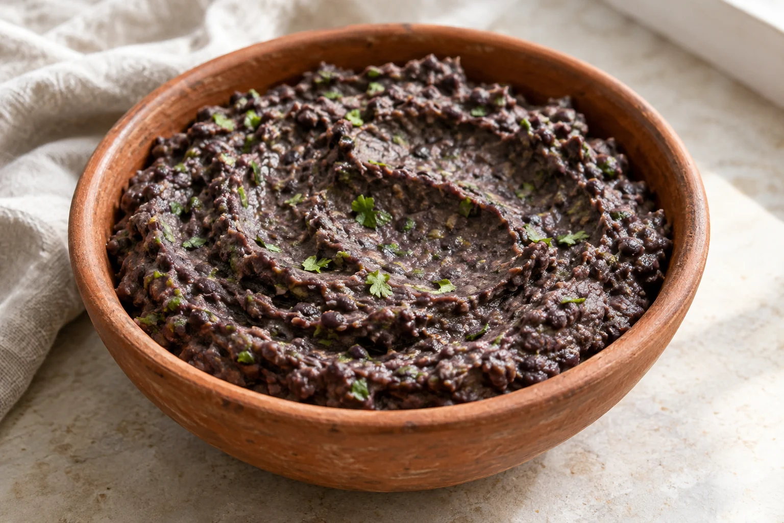 A thick black-bean spread brightened with lime, cilantro and gently bloomed paprika.